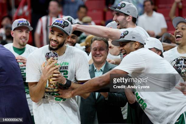 Jayson Tatum of the Boston Celtics celebrates with Al Horford after being awarded the Eastern Conference Larry Bird MVP trophy after defeating the...