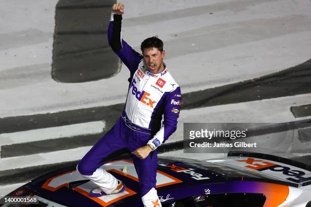Denny Hamlin, driver of the FedEx Ground Toyota, celebrates after winning the NASCAR Cup Series Coca-Cola 600 at Charlotte Motor Speedway on May 29,...