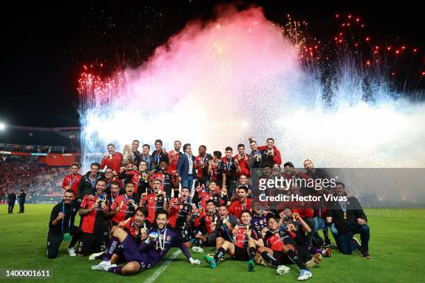 Players of Atlas pose for photos after winning the final second leg match between Pachuca and Atlas as part of the Torneo Grita Mexico C22 Liga MX at...
