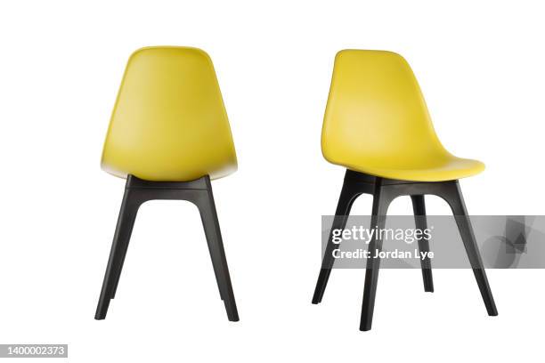 two yellow color plastic chairs - back of chair stock pictures, royalty-free photos & images