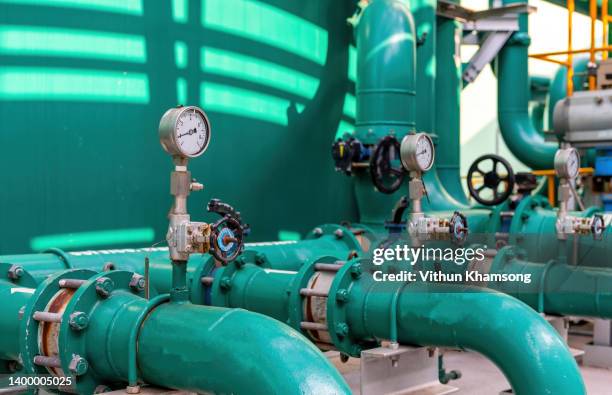 valves and pipeline system of industrial zone - anatomical valve stock pictures, royalty-free photos & images