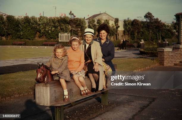 children, grandmother & mother in playground - retro portrait frau mother stock-fotos und bilder