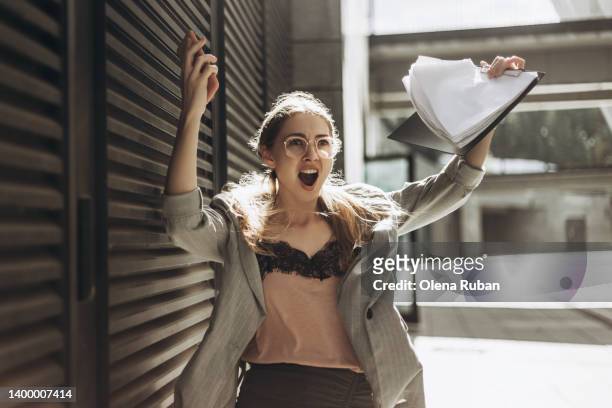 young emotional woman raised her hands up. - happy ending stock pictures, royalty-free photos & images