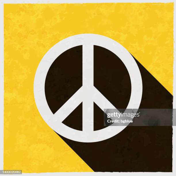 peace. icon with long shadow on textured yellow background - hippie protest stock illustrations