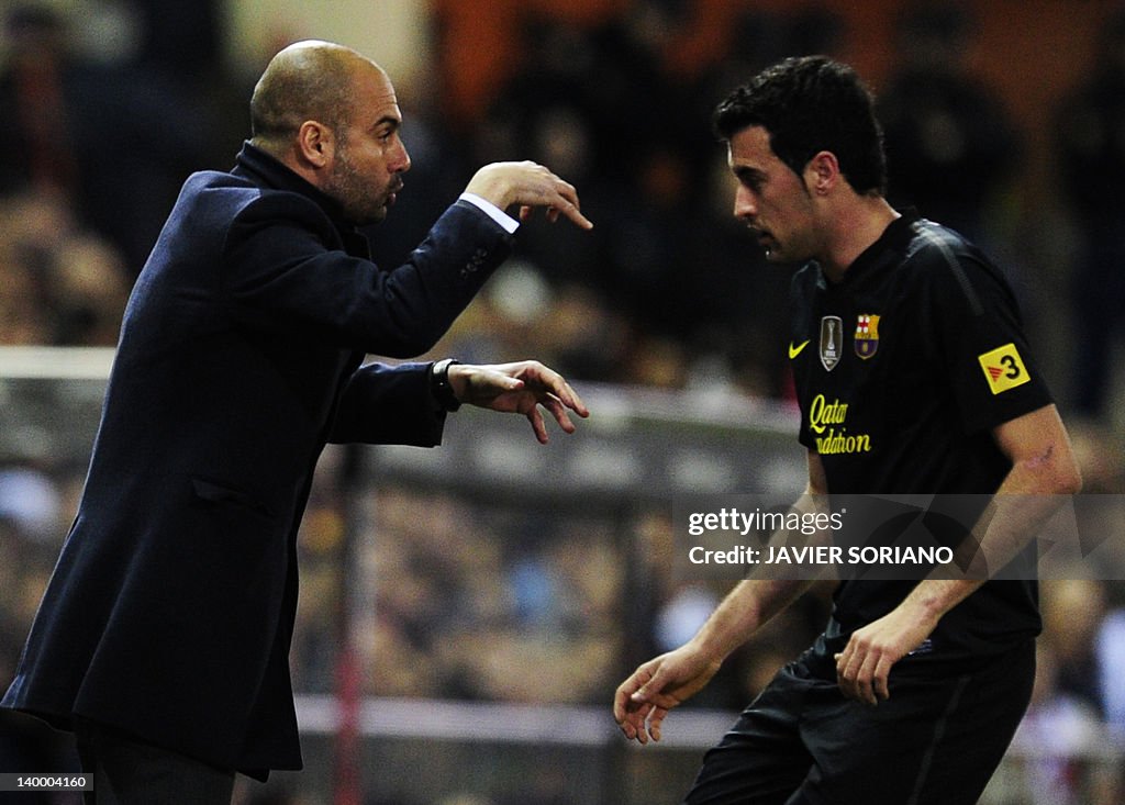 Barcelona's coach Josep Guardiola (L) sp