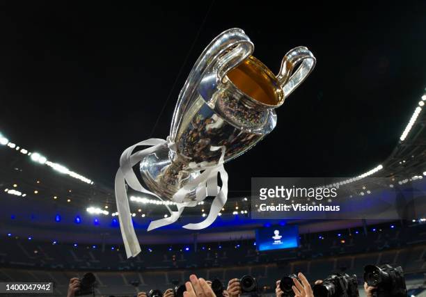 The Champions League trophy is thrown in the air after the UEFA Champions League final match between Liverpool FC and Real Madrid at Stade de France...