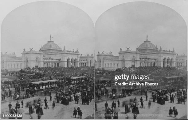 Stereoscopic image showing visitors arriving by tram with the Memorial Hall beyond at the opening of the Centennial International Exhibition, in...