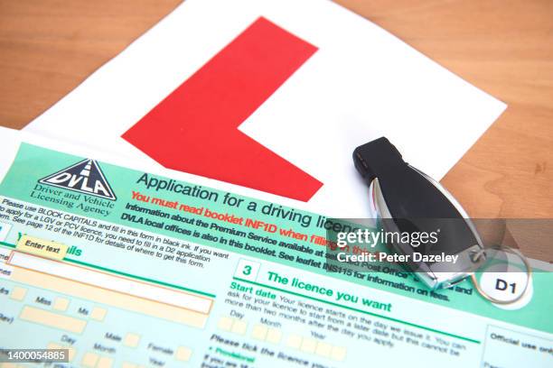 In this photo illustration a DVLA application form for a UK driving license for a car, motorbike, moped or other vehicle on a table on May 27,2022 in...