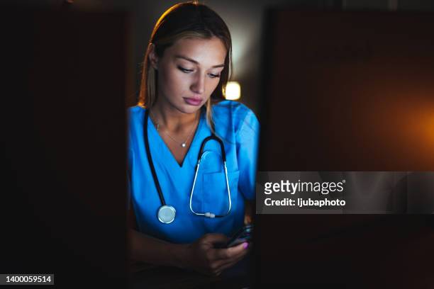 female physical therapist confirms patient appointment - nurse thinking stock pictures, royalty-free photos & images