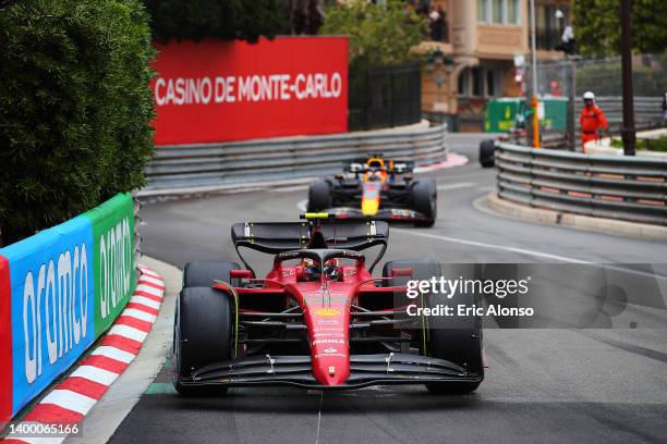 Carlos Sainz of Spain driving the Ferrari F1-75 and Max Verstappen of the Netherlands driving the Oracle Red Bull Racing RB18 Honda during the F1...
