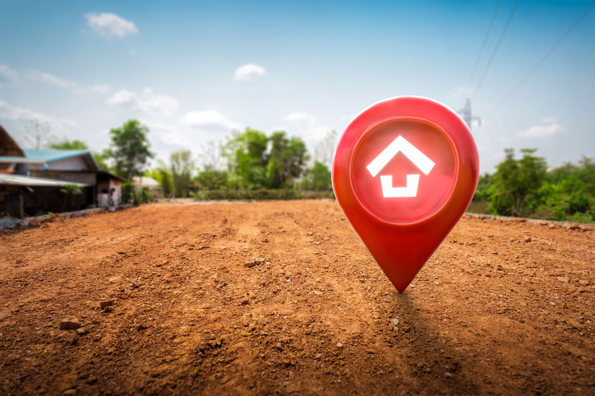 House symbol with location pin icon on empty dry cracked swamp reclamation soil in real estate sale or property investment concept. House symbol with location pin icon on empty dry cracked swamp reclamation soil in real estate sale or property investment concept.