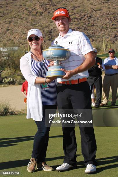 Hunter Mahan holds the Walter Hagen Cup while celebrating with his wife Kandi after winning the championship match during the final round of the...