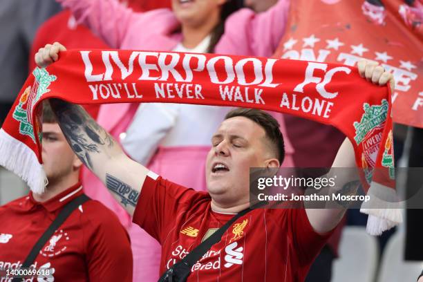 Liverpool FC fans sing whilst You'll Never Walk Alone is played during the UEFA Champions League final match between Liverpool FC and Real Madrid at...