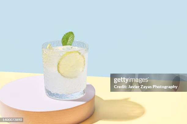 Fresh Homemade Lemonade Glass On Blue Colored Background, Foto de stock