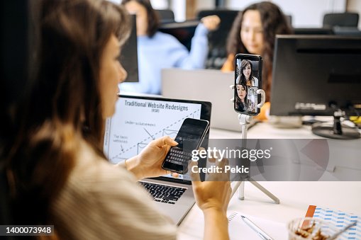 Young businesswoman on a online meeting in office Young businesswoman on a online meeting in office