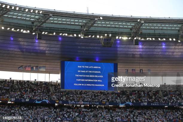 Notice is displayed on the stadium screen warning of a delay to kick off following security issues with fans outside the stadium prior to the UEFA...