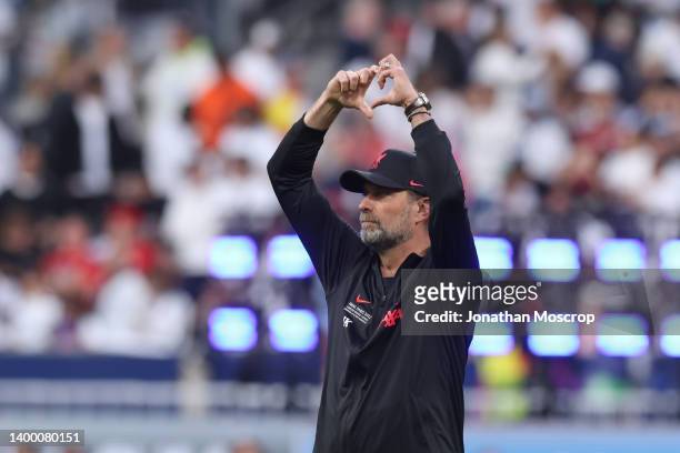 Jurgen Klopp Head coach of Liverpool FC makes a heart shaped form with his hands towards the crowd prior to the UEFA Champions League final match...