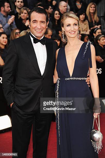 Actor Jean Dujardin and wife Alexandra Lamy arrive at the 84th Annual Academy Awards held at the Hollywood & Highland Center on February 26, 2012 in...