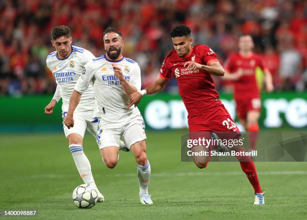 Luis Diaz of Liverpool is challenged by Daniel Carvajal of Real Madrid as Federico Valverde looks on during the UEFA Champions League final match...