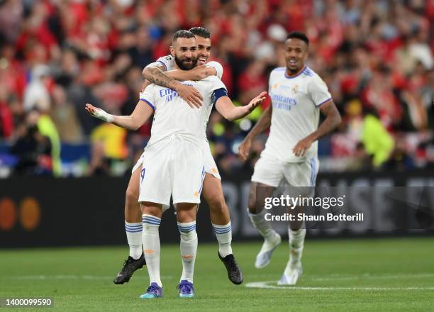 Karim Benzema and Dani Ceballos of Real Madrid celebrate following their sides victory in the UEFA Champions League final match between Liverpool FC...