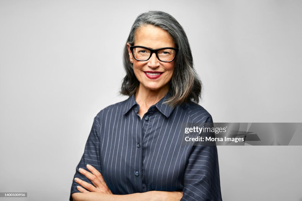 Mature female CEO with arms crossed