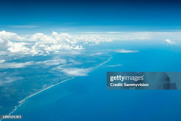 high angle view of island coastline - above the clouds stock pictures, royalty-free photos & images