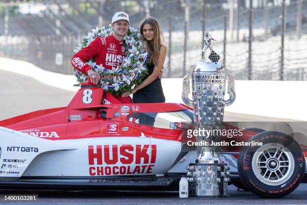 Marcus Ericsson of Sweden poses with girlfriend Iris Tritsaris Jondahl and the Borg-Warner Trophy during the 106th Indianapolis 500 champion's...