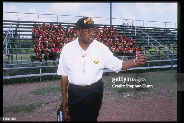 Coach Eddie Robinson of the Grambling State Tigers stands on the field during Media Day in Grambling, Louisiana.