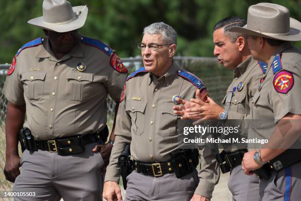 Steven C. McCraw, Director and Colonel of the Texas Department of Public Safety , speaks with DPS State Troopers near Robb Elementary School on May...