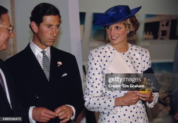Prince Charles and Princess Diana - wearing a blue and white polka dot outfit by Jan Van Velden at new parliament house in Canberra, Australia, 7th...