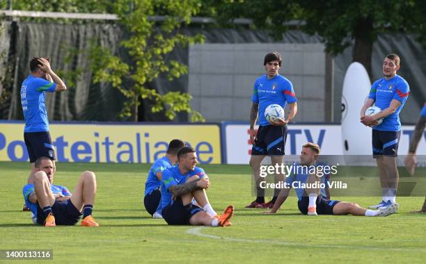 Leonardo Bonucci, Federico Bernardeschi, Sandro Tonali, Davide Frattesi and Andrea Belotti of Italy look on during Italy training session at Centro...