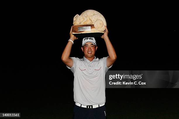 John Huh of the United States poses with the trophy after winning the Mayakoba Golf Classic at Riviera Maya-Cancún held at El Camaleon Golf Club at...