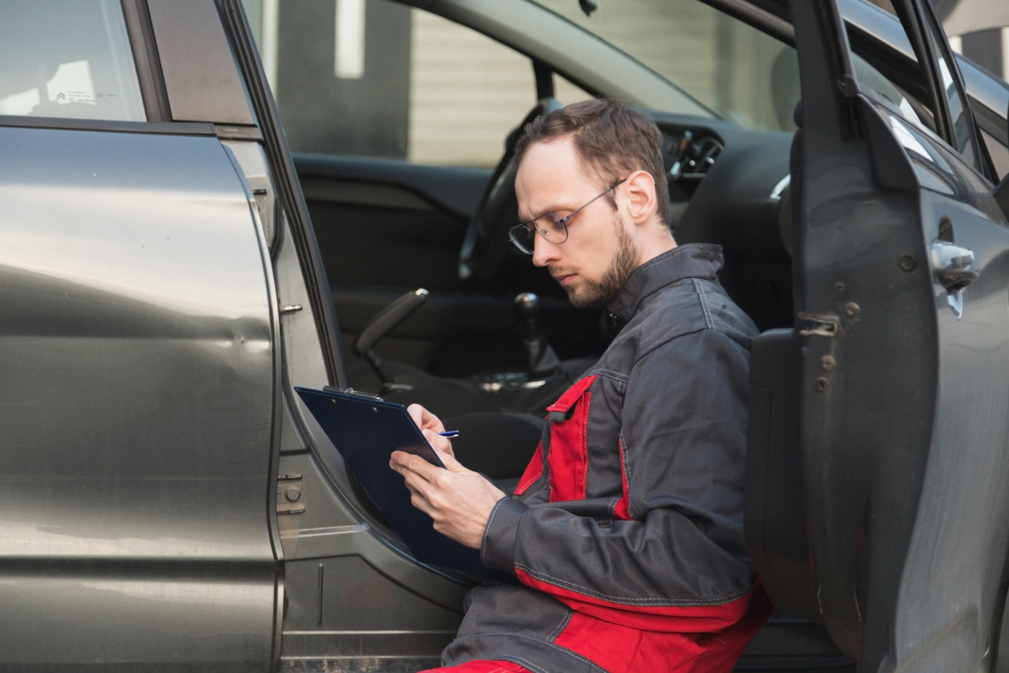 mechanic checking car