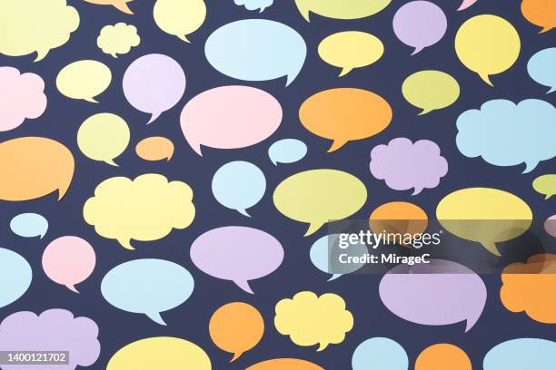 a variety of colorful paper chat bubbles on purple - thought bubble stock pictures, royalty-free photos & images