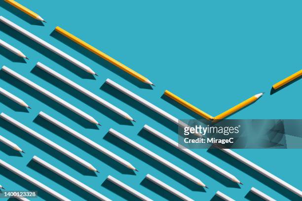 pencil broken and turned to separate from the crowd - rebellion stockfoto's en -beelden