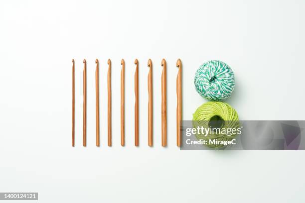 crochet hooks with balls of wool - crochet stock pictures, royalty-free photos & images