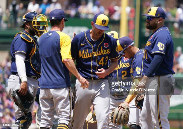 Manager Craig Counsell of the Milwaukee Brewers removes Ethan Small of the Milwaukee Brewers during the third inning of Game One of a doubleheader...