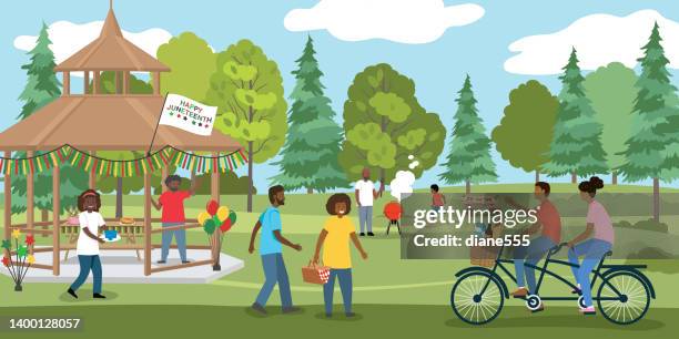 eine gruppe von menschen, die den juneteenth-feiertag im park feiern - picknick park stock-grafiken, -clipart, -cartoons und -symbole