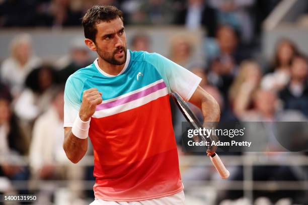 Marin Cilic of Croatia celebrates against Daniil Medvedev during the Men's Singles Fourth Round match on Day 9 of The 2022 French Open at Roland...