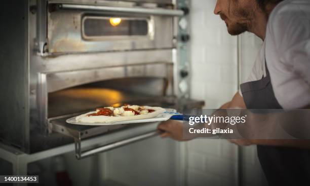 making pizza - pizza stand stock pictures, royalty-free photos & images