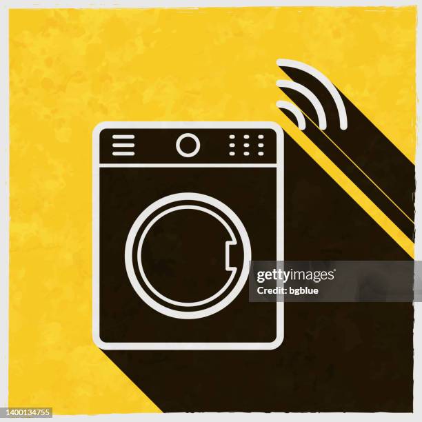 smart washing machine. icon with long shadow on textured yellow background - laundry stain stock illustrations