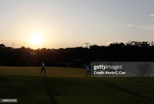 John Huh of the United States and Robert Allenby of Australia walk to the 10th green and the fifth playoff hole during the final round of the...