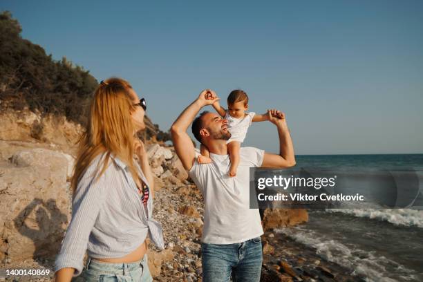 happy family with baby girl on summer vacation - macedonia greece stock pictures, royalty-free photos & images