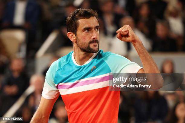 Marin Cilic of Croatia celebrates against Daniil Medvedev during the Men's Singles Fourth Round match on Day 9 of The 2022 French Open at Roland...