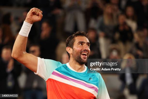 Marin Cilic of Croatia celebrates victory against Daniil Medvedev during the Men's Singles Fourth Round match on Day 9 of The 2022 French Open at...