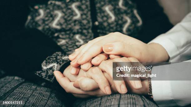holding touching hands asian senior or elderly old lady woman patient with love, care, helping, encourage and empathy at nursing hospital ward : healthy strong medical concept - medical thank you imagens e fotografias de stock