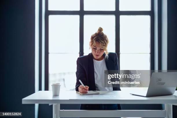 successful business woman working in the modern office with big window - formal letter stock pictures, royalty-free photos & images