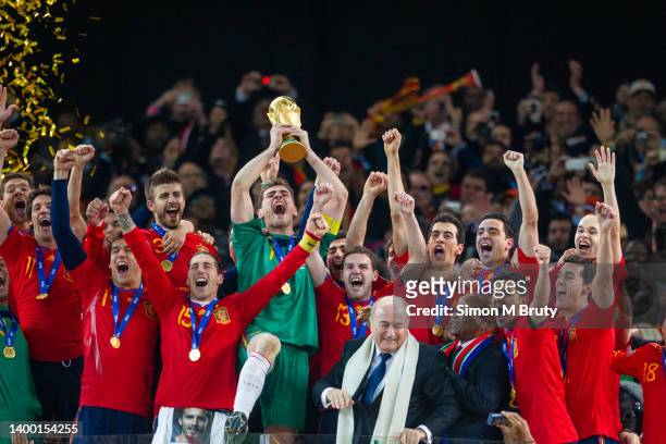 Iker Casillas Captain of Spain celebrates with the trophy after being handed it by Sepp Blatter, FIFA President and Jacob Zuma President of South...