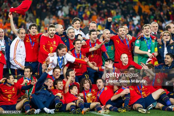 The Spanish team celebrate with the World Cup trophy. In the center with the trophy is Carlos Puyol after victory in the World Cup Final match...