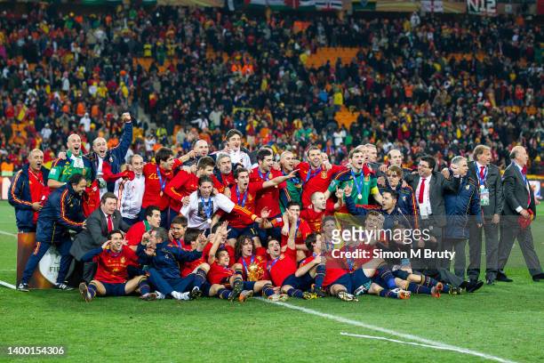 The Spanish team celebrate with the World Cup trophy. In the center with the trophy is Carlos Puyol after victory in the World Cup Final match...